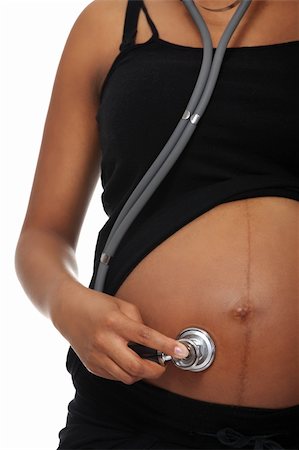 pregnant stethoscope - Pregnant woman listening her belly with stethoscope , isolated on white background Stock Photo - Budget Royalty-Free & Subscription, Code: 400-05356523