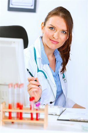 simsearch:400-04925813,k - Portrait of attractive medical doctor woman sitting in office Stock Photo - Budget Royalty-Free & Subscription, Code: 400-05356799