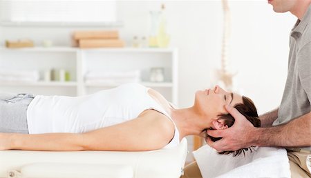 Chiropractor stretching a cute woman in a room Stockbilder - Microstock & Abonnement, Bildnummer: 400-05357086