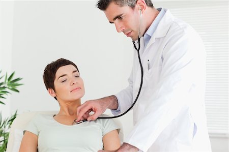 Doctor examining a patient in a room Stock Photo - Budget Royalty-Free & Subscription, Code: 400-05357169