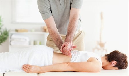 Charming Woman relaxing during a back-massage in a room Photographie de stock - Aubaine LD & Abonnement, Code: 400-05357186