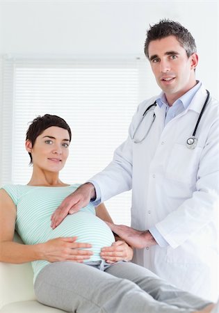 Portrait of a male doctor and a pregnant woman in a room Stock Photo - Budget Royalty-Free & Subscription, Code: 400-05357228