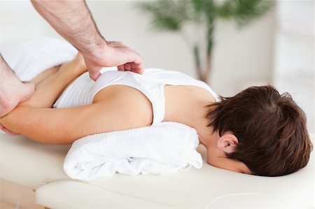 Gorgeous Woman getting a shoulder-massage in a room Stockbilder - Microstock & Abonnement, Bildnummer: 400-05357222