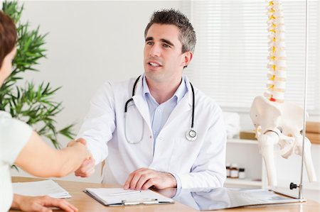 Doctor greeting a patient in a room Stock Photo - Budget Royalty-Free & Subscription, Code: 400-05357300