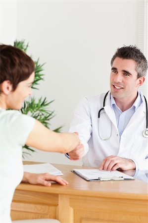 Male Doctor greeting a patient in a room Stock Photo - Budget Royalty-Free & Subscription, Code: 400-05357302