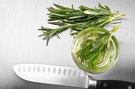 simsearch:400-04062145,k - Sprigs of rosemary leaves with cutting on stainless steel counter Stock Photo - Budget Royalty-Free & Subscription, Code: 400-05357322