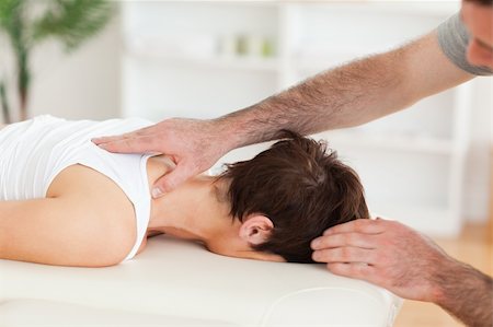 Handsome Man massaging a woman's neck in a room Stockbilder - Microstock & Abonnement, Bildnummer: 400-05357337