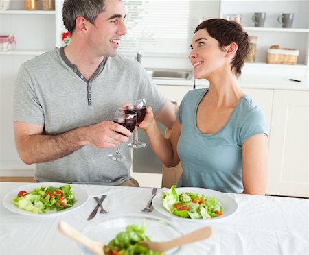 simsearch:400-05357363,k - Close up of a cute couple toasting with redwine in a dining room Photographie de stock - Aubaine LD & Abonnement, Code: 400-05357367