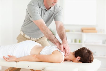 physical therapy shoulder - Handsome Guy massaging a cute woman's neck in a room Stock Photo - Budget Royalty-Free & Subscription, Code: 400-05357377