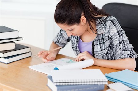 simsearch:400-04175049,k - A cute young student doing her homework Stock Photo - Budget Royalty-Free & Subscription, Code: 400-05357544