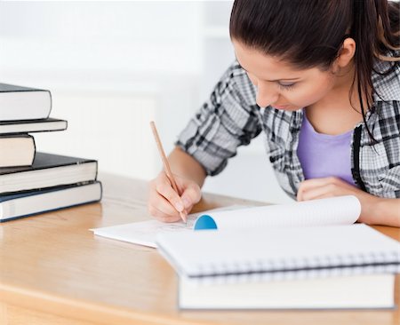 simsearch:400-04175049,k - A young student is learning between books Stock Photo - Budget Royalty-Free & Subscription, Code: 400-05357547