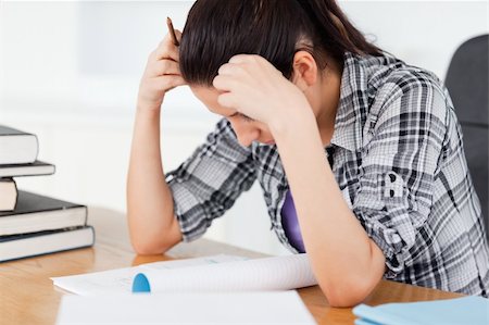 simsearch:400-04175049,k - A stressed student is learning between books Stock Photo - Budget Royalty-Free & Subscription, Code: 400-05357559