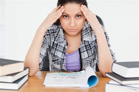 simsearch:400-04175049,k - A stressed student with homework is looking into the camera Stock Photo - Budget Royalty-Free & Subscription, Code: 400-05357562