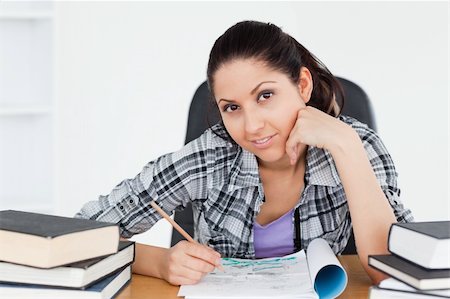 simsearch:400-04175049,k - A cute young student is doing her homework Stock Photo - Budget Royalty-Free & Subscription, Code: 400-05357574