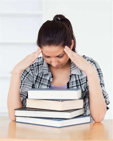 simsearch:400-04175049,k - A frustrated young student is leaning on books Stock Photo - Budget Royalty-Free & Subscription, Code: 400-05357584