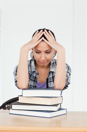 simsearch:400-04175049,k - A depressed young student is resting on her books Stock Photo - Budget Royalty-Free & Subscription, Code: 400-05357583