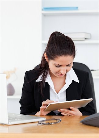 A young businesswoman holding a touchpad Stock Photo - Budget Royalty-Free & Subscription, Code: 400-05357617