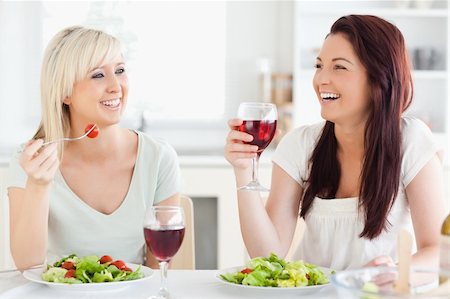Young women drinking wine in a kitchen Stock Photo - Budget Royalty-Free & Subscription, Code: 400-05357636