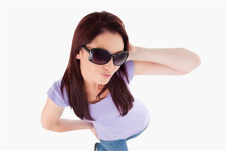 simsearch:400-06769983,k - Woman with sunglasses in a studio Foto de stock - Royalty-Free Super Valor e Assinatura, Número: 400-05357886