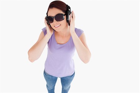 simsearch:400-06769983,k - Smiling Woman with headphones and sunglasses in a studio Foto de stock - Royalty-Free Super Valor e Assinatura, Número: 400-05357895