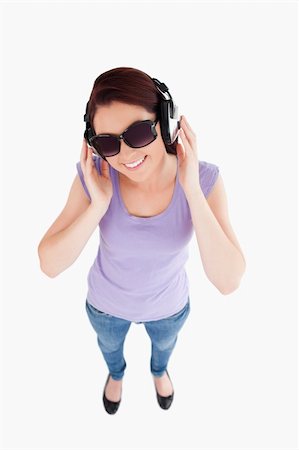 simsearch:400-06769983,k - Gorgeous Woman with headphones and sunglasses in a studio Foto de stock - Royalty-Free Super Valor e Assinatura, Número: 400-05357897