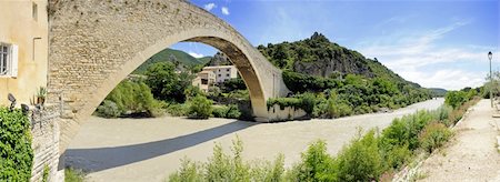 drome - The Medieval bridge over the river Eygues in Nyons, Drome en Provence, completed in 1407, with a single span of 40,5 meters Stock Photo - Budget Royalty-Free & Subscription, Code: 400-05358045