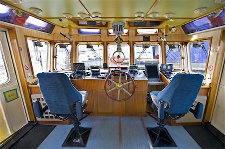 schlepper (boot) - The wheelhouse of a fireboat with various navigational equipment Stockbilder - Microstock & Abonnement, Bildnummer: 400-05358133