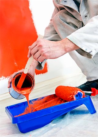 paint poured on someone - Painter pouring orange paint from a can into a tray, whilst working Stock Photo - Budget Royalty-Free & Subscription, Code: 400-05358371