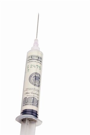 simsearch:625-02266093,k - American money in a syringe on a white background. Fotografie stock - Microstock e Abbonamento, Codice: 400-05358449