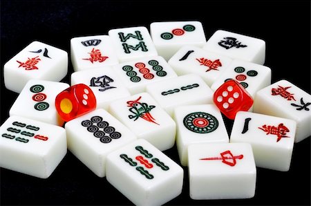 symbols dice - Chinese mahjong tiles and dices on a black background Photographie de stock - Aubaine LD & Abonnement, Code: 400-05358578