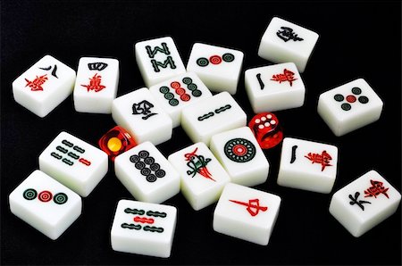 symbols dice - Chinese mahjong tiles and dices on a black background Photographie de stock - Aubaine LD & Abonnement, Code: 400-05358579