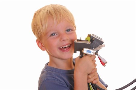 Young boy showing lots of different computer cables Stock Photo - Budget Royalty-Free & Subscription, Code: 400-05358594