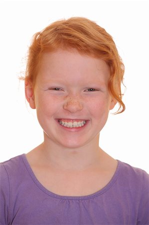 simsearch:400-05712134,k - Portrait of a smiling red haired girl Photographie de stock - Aubaine LD & Abonnement, Code: 400-05358591