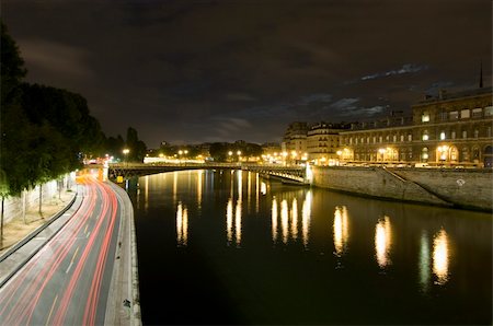 simsearch:400-05358650,k - A nightly view over the Seine with it's many bridges, and ring road, close to Ile de la Cite. The moon shines through a break in the clouds Stock Photo - Budget Royalty-Free & Subscription, Code: 400-05358733