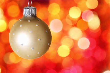 simsearch:400-05359450,k - Christmas tree decoration against red blurred background Stock Photo - Budget Royalty-Free & Subscription, Code: 400-05359456