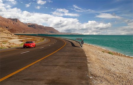dead people in deserts - Red car on a highway that runs along the Dead Sea from one side and Edom Mountains at Arava Desert from the other in Israel. Stock Photo - Budget Royalty-Free & Subscription, Code: 400-05359555