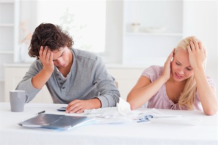 Couple in great despair in their living room Stock Photo - Budget Royalty-Free & Subscription, Code: 400-05350385