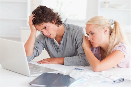 simsearch:400-05746763,k - Upset couple with bills and a notebook in their living room Stock Photo - Budget Royalty-Free & Subscription, Code: 400-05350397