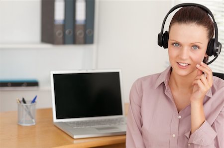simsearch:400-05209692,k - An operator with headset by laptop Stock Photo - Budget Royalty-Free & Subscription, Code: 400-05350457