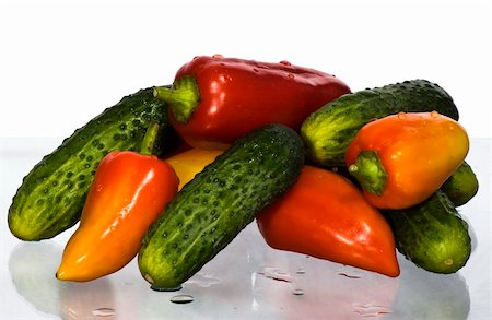 cucumbers and peppers on a white background Photographie de stock - Aubaine LD & Abonnement, Code: 400-05351316
