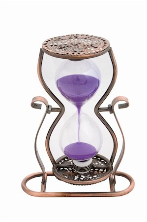 simsearch:700-00028206,k - Hourglass with purple sand isolated on white background Photographie de stock - Aubaine LD & Abonnement, Code: 400-05351956