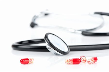 Doctor's stethoscope and pills closeup Stock Photo - Budget Royalty-Free & Subscription, Code: 400-05351968