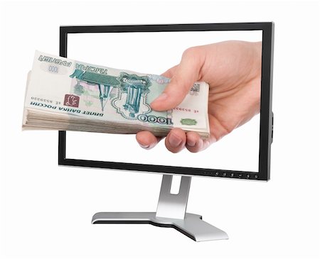Hand with money and computer monitor isolated on white background Stock Photo - Budget Royalty-Free & Subscription, Code: 400-05351972