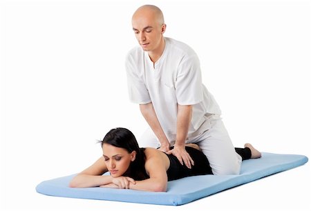 shiatsu - Woman lying on mat receiving massage from thai therapist, isolated on white Foto de stock - Super Valor sin royalties y Suscripción, Código: 400-05352118