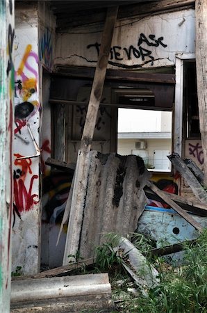 Broken cement asbestos roofing in derelict house. Hazardous waste in urban area. Stock Photo - Budget Royalty-Free & Subscription, Code: 400-05352389