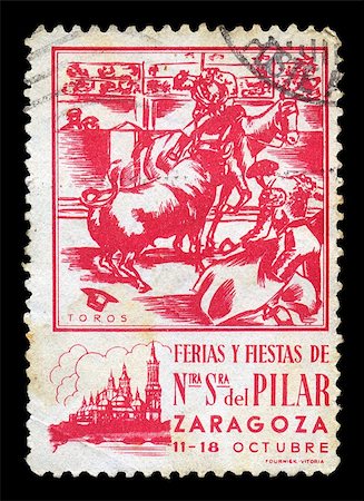 philately - SPAIN - CIRCA 1930's. Vintage postage stamp for a fair and fiesta at the Basilica Cathedral de Nuestra Senora del Pilar in the city of Zaragoza with matador and cavaleiro bullfighting illustration, circa 1930's. Stock Photo - Budget Royalty-Free & Subscription, Code: 400-05352394