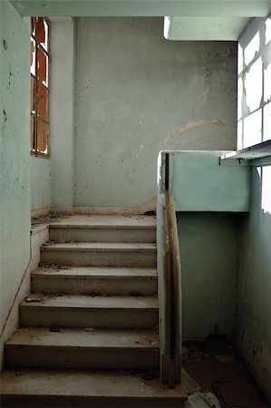 simsearch:400-05352419,k - Dirty staircase and peeling walls. Abandoned building interior. Fotografie stock - Microstock e Abbonamento, Codice: 400-05352422