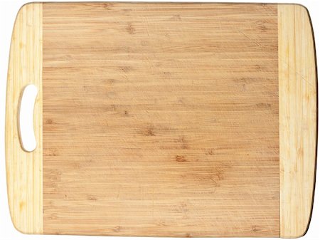 Isolated used wooden cutting board. Clipping path included Stock Photo - Budget Royalty-Free & Subscription, Code: 400-05352624
