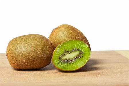 Fresh juicy colorful kiwis on a cutting board Stock Photo - Budget Royalty-Free & Subscription, Code: 400-05352625