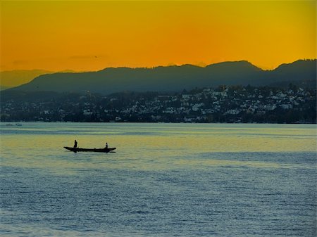 simsearch:400-05369767,k - Sea blue boat golden sunset Stock Photo - Budget Royalty-Free & Subscription, Code: 400-05352669